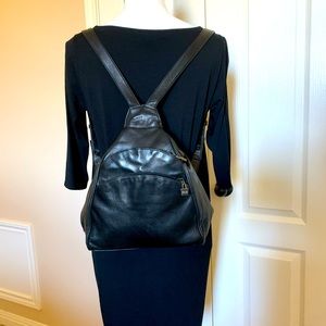Perlina Black leather domed shaped backpack.
